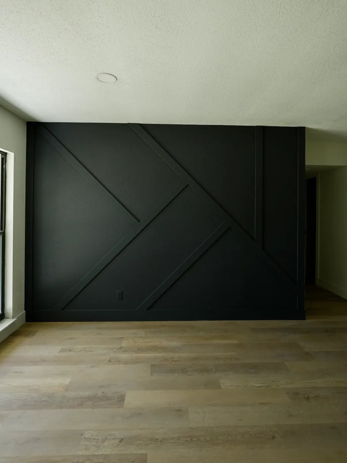 Dark green geometric trim accent wall