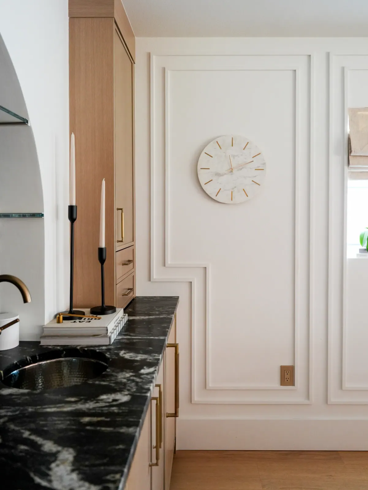 Picture-frame millwork and a marble bar