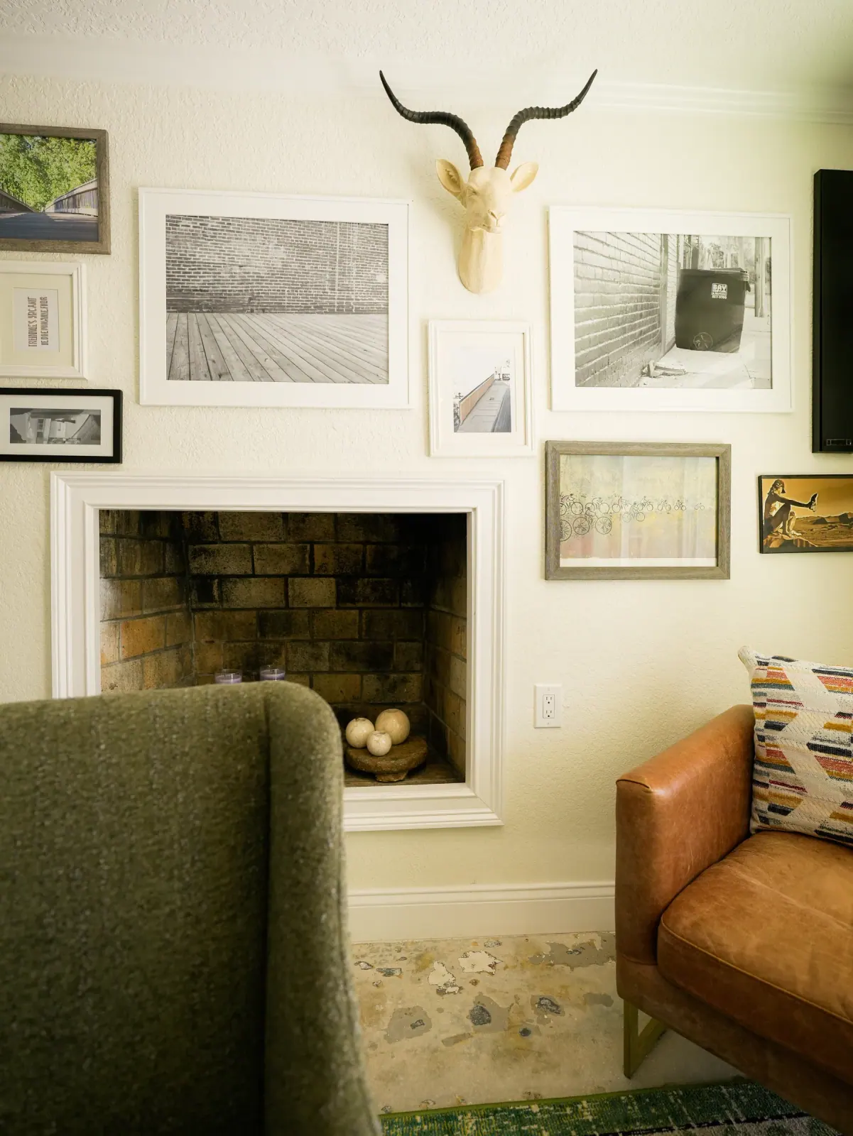 Restored fireplace with a gallery wall