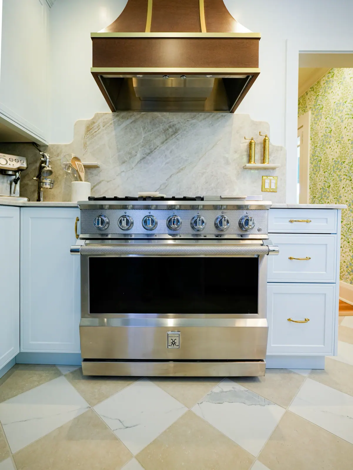 Professional range framed by marble backsplash