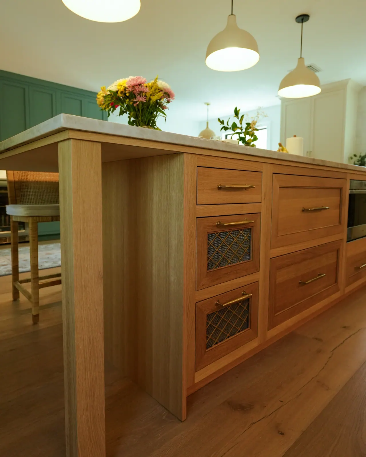 White oak island with inset drawers and a quartz top