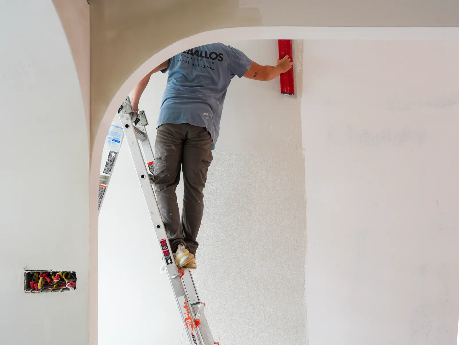 Applying microcement to a showroom wall
