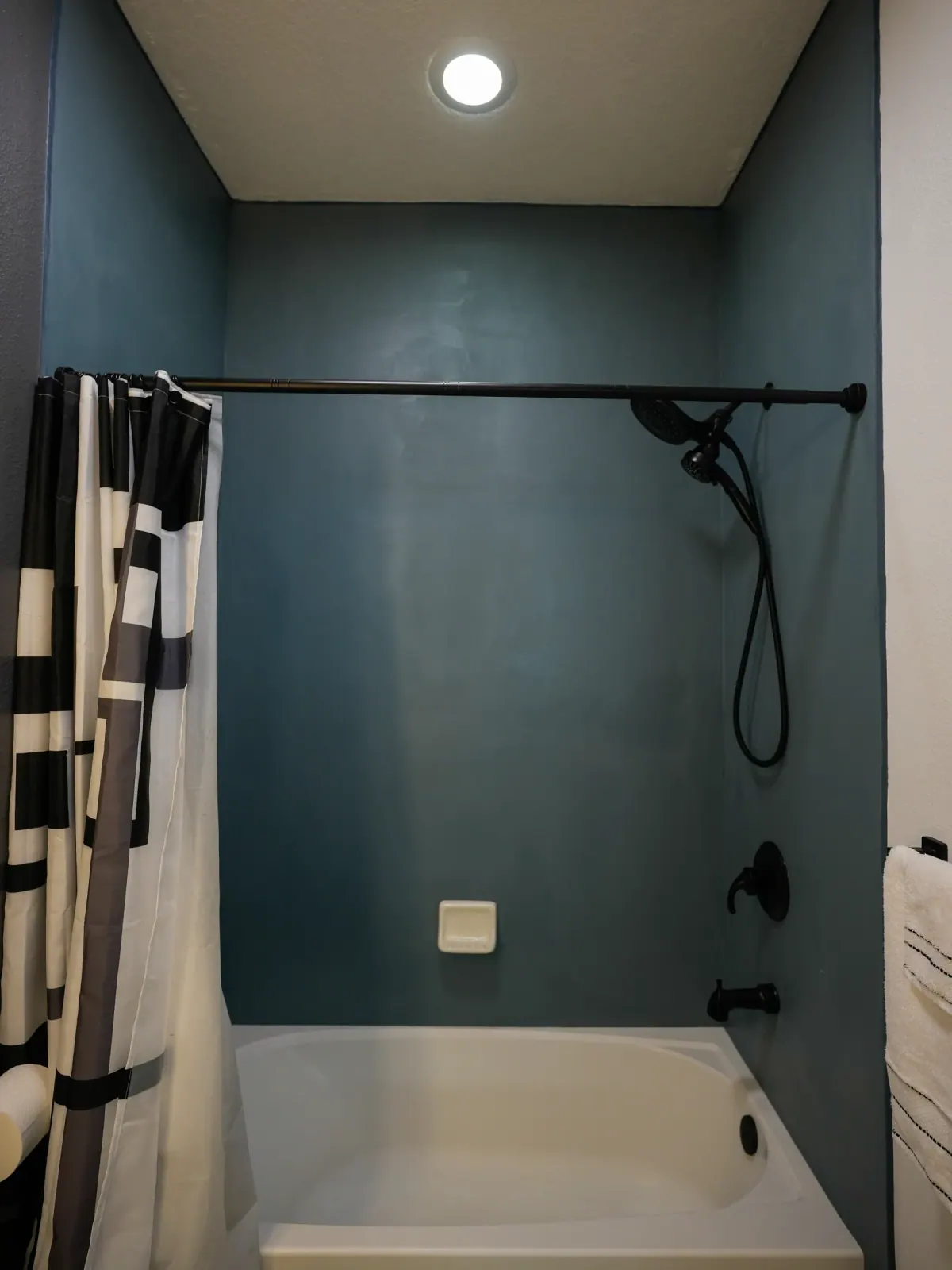 Seamless teal microcement shower walls